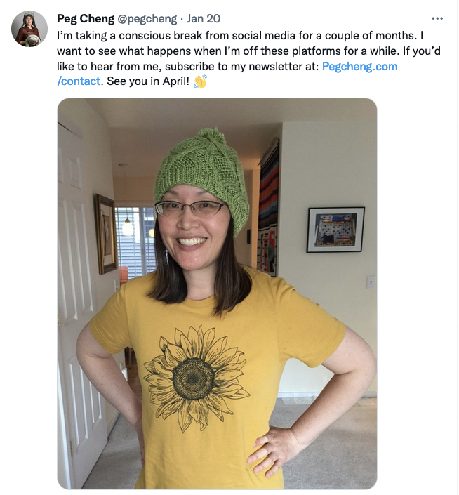 Peg Cheng wearing a green knitted hat and a sunflower-printed t-shirt